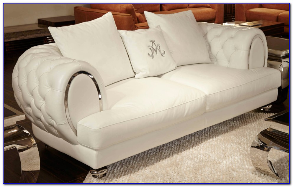 white button tufted leather sofa with rolled arms